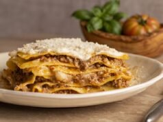 Lasagna al forno alla bolognese Layered lasagna al forno alla bolognese with ragù, béchamel, and parmesan cheese