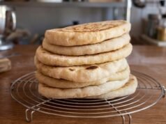Home-Made Turkish Bread (Bazlama) Stack of homemade bazlama Turkish flatbreads on cooling rack in kitchen