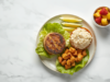 Gluten Free Fast Food: Best Restaurants, Safer Orders & What to Avoid Gluten free fast food plate with bunless burger patty, rice, potatoes, apple slices, lettuce, and fresh fruit